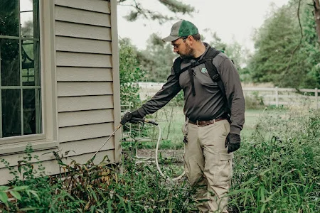 spraying exterior of house