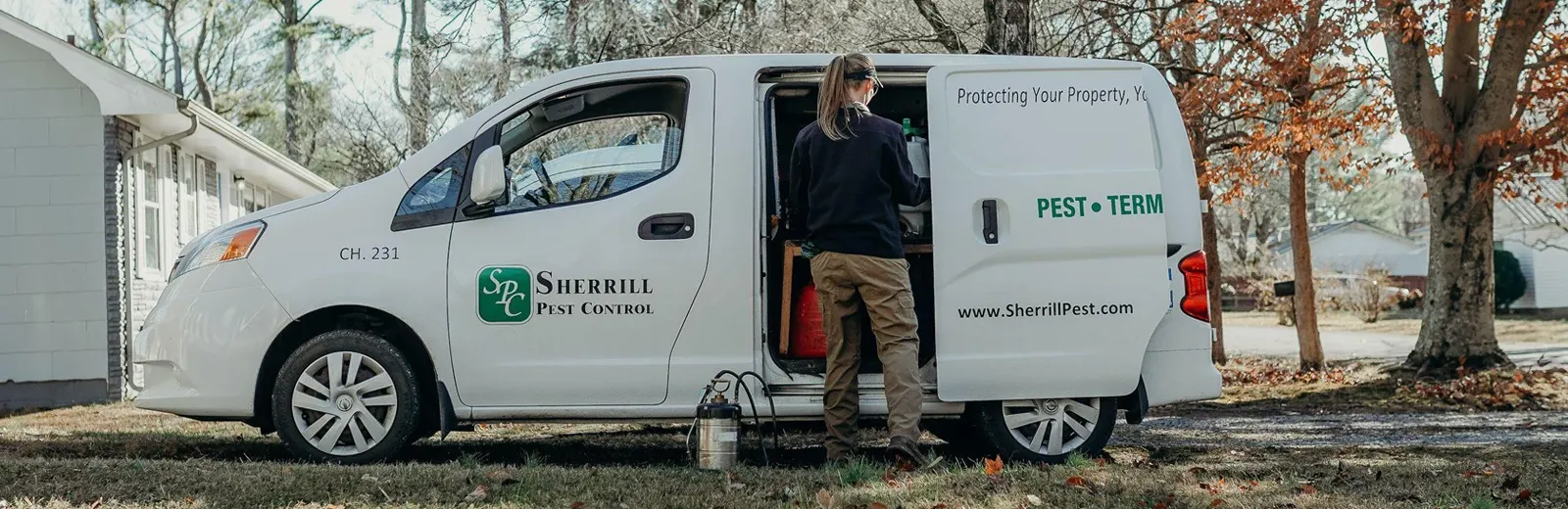 technician next to van preparing for pest control inspection